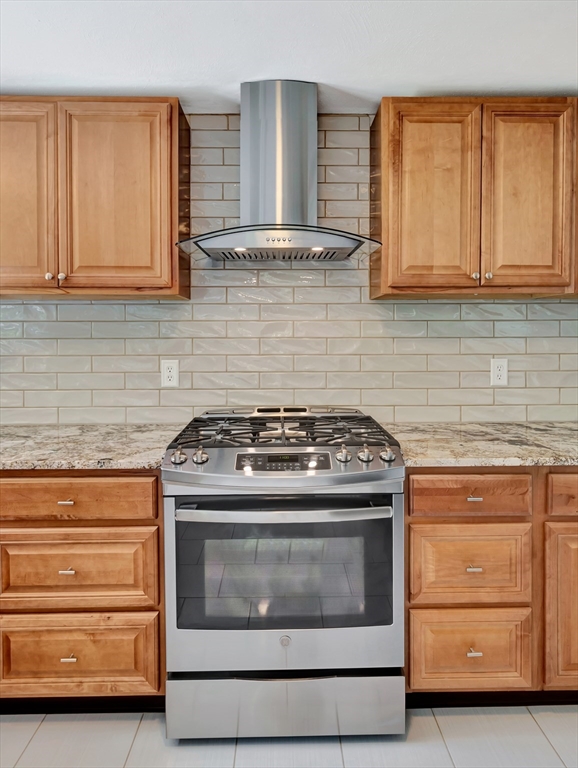 4 Gary Road Norton, MA 02766 - Photo 15 of 42 a stove top oven sitting inside of a kitchen