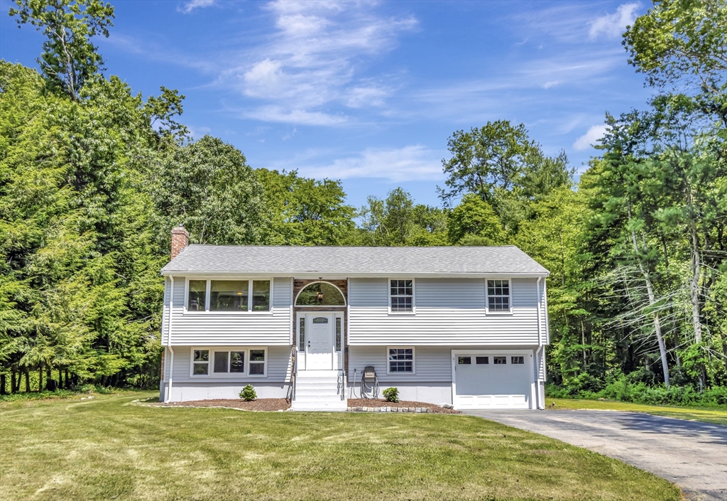 4 Gary Road Norton, MA 02766 - Photo 2 of 42 an aerial view of a house with a yard table and chairs
