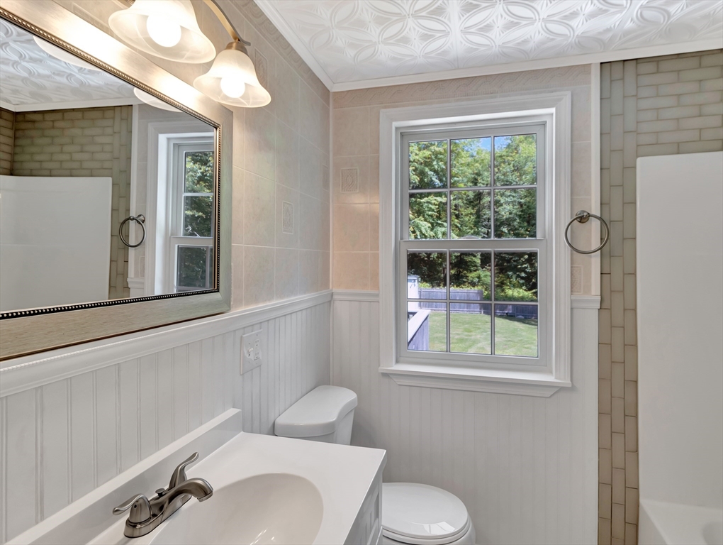 4 Gary Road Norton, MA 02766 - Photo 25 of 42 a bathroom with a toilet sink and window