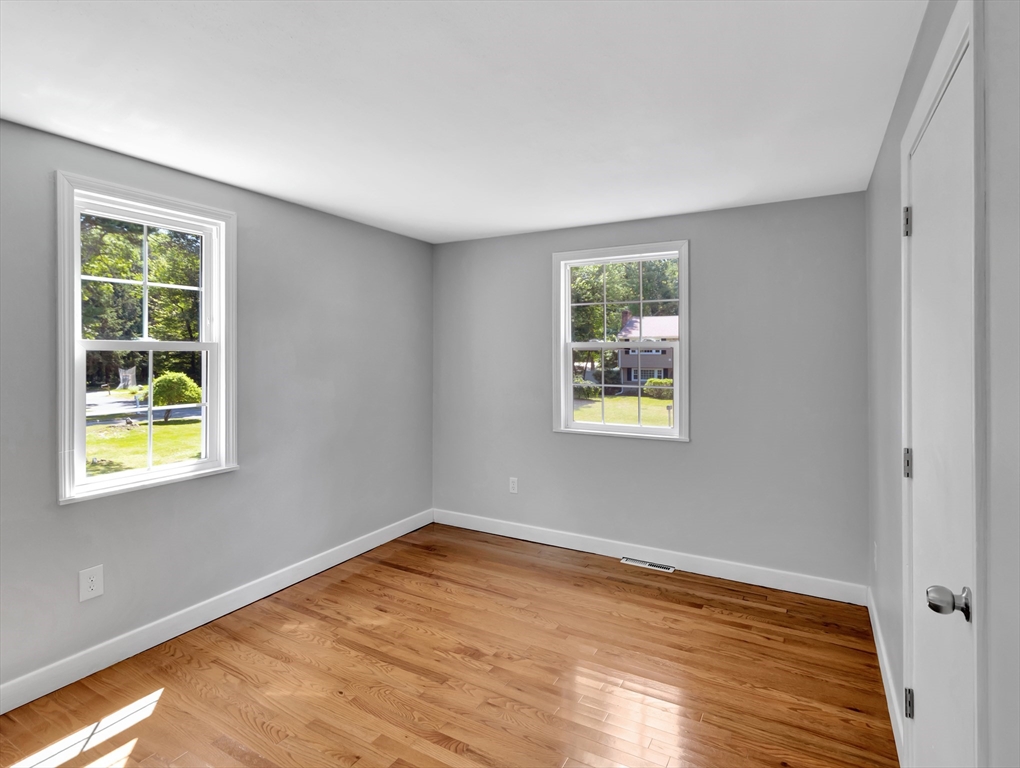 4 Gary Road Norton, MA 02766 - Photo 28 of 42 a view of an empty room with wooden floor and a window