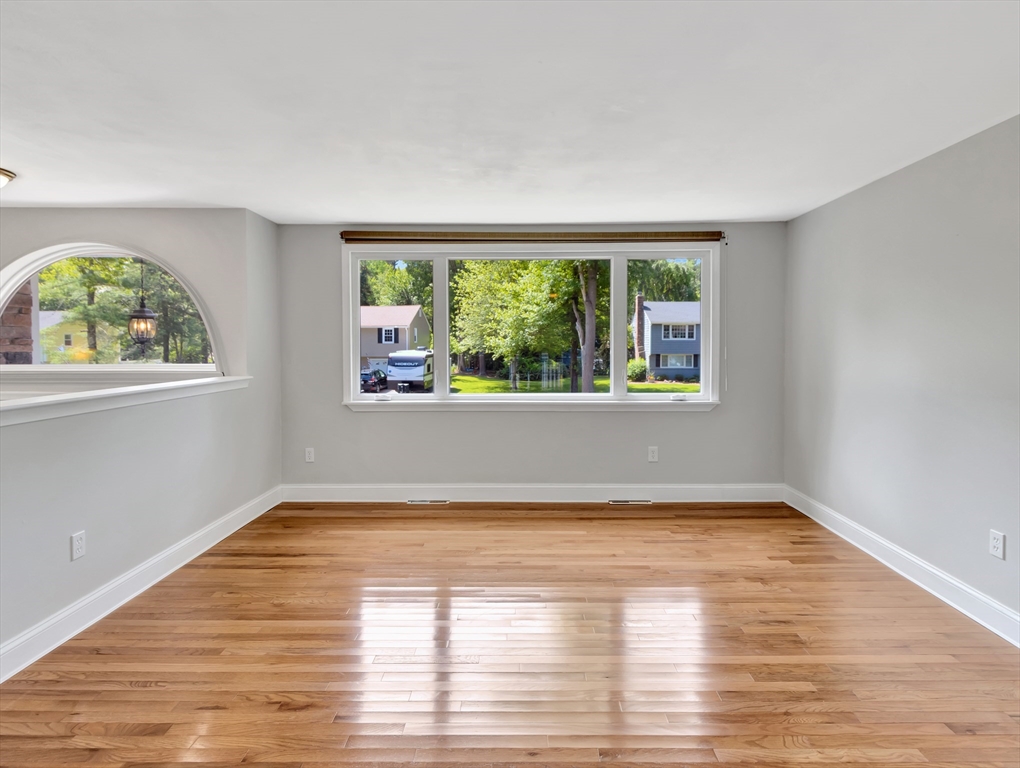 4 Gary Road Norton, MA 02766 - Photo 7 of 42 a view of an empty room with wooden floor and a window