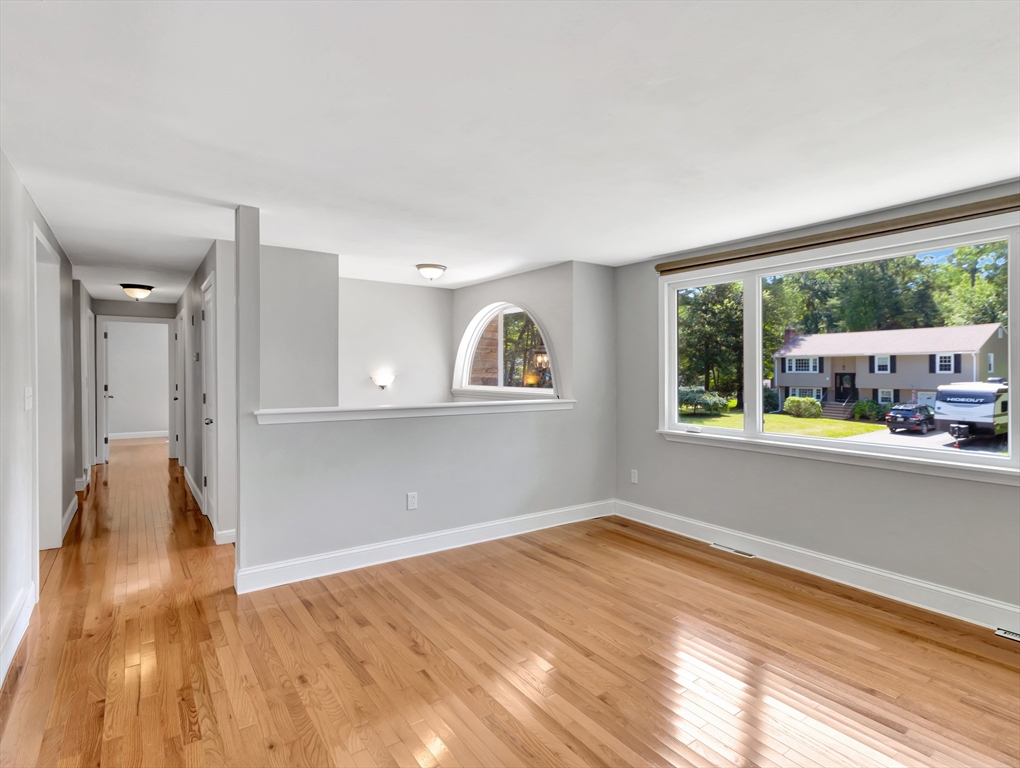 4 Gary Road Norton, MA 02766 - Photo 8 of 42 a view of empty room with wooden floor and fan