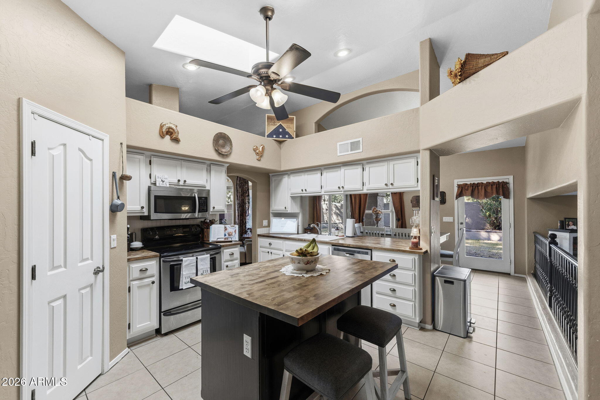 844 North Oracle Circle Mesa, AZ 85203 - Photo 15 of 34 a kitchen with a counter space cabinets and stainless steel appliances