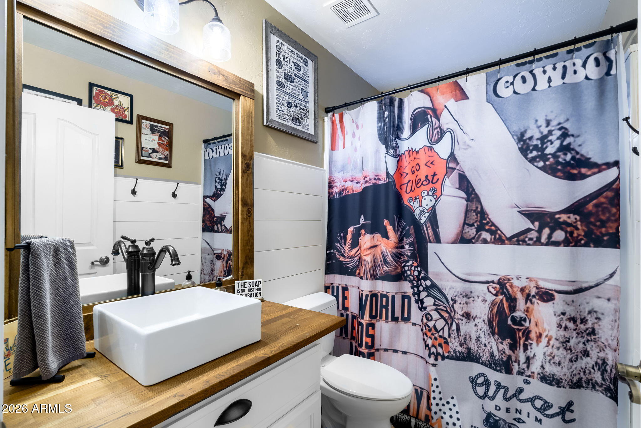 844 North Oracle Circle Mesa, AZ 85203 - Photo 24 of 34 a bathroom with a sink toilet and mirror