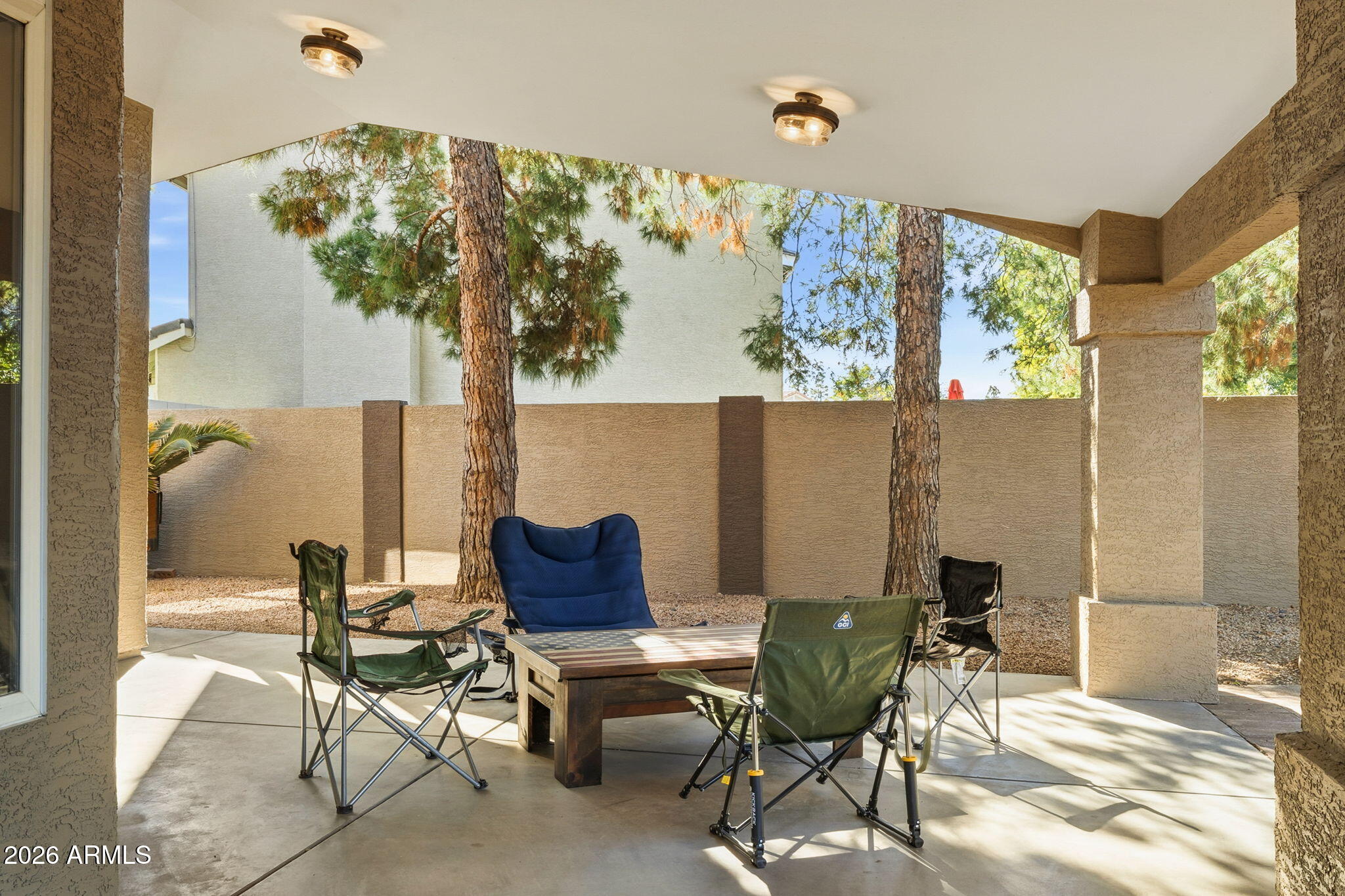 844 North Oracle Circle Mesa, AZ 85203 - Photo 27 of 34 a outdoor living space with furniture and a large window