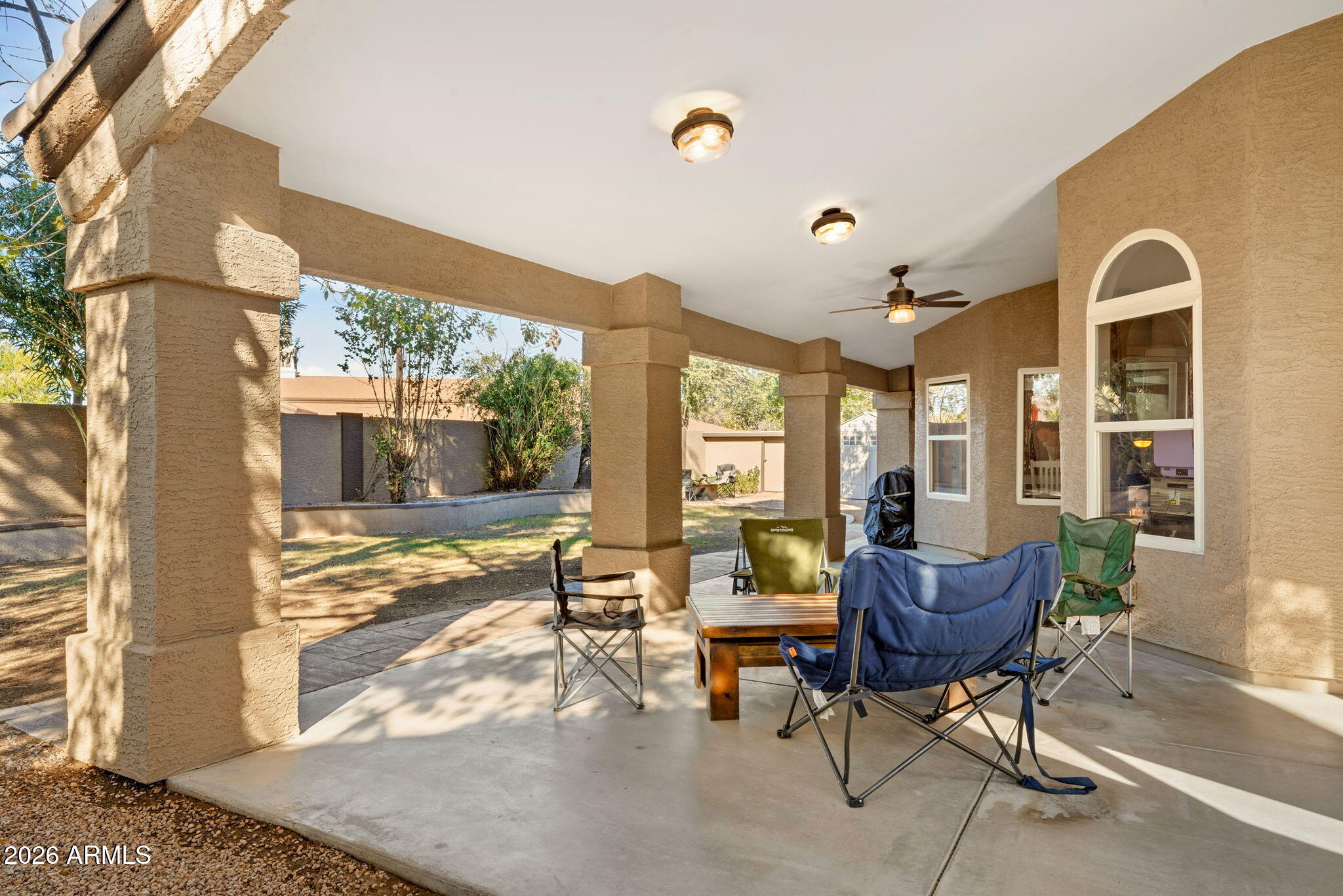 844 North Oracle Circle Mesa, AZ 85203 - Photo 29 of 34 a view of a house with backyard porch and sitting area
