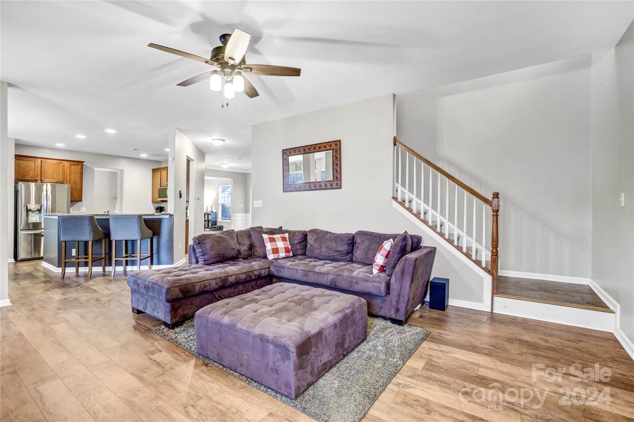 14432 Whistling Swan Road Charlotte, NC 28278 - Photo 11 of 28 a living room with furniture and a ceiling fan