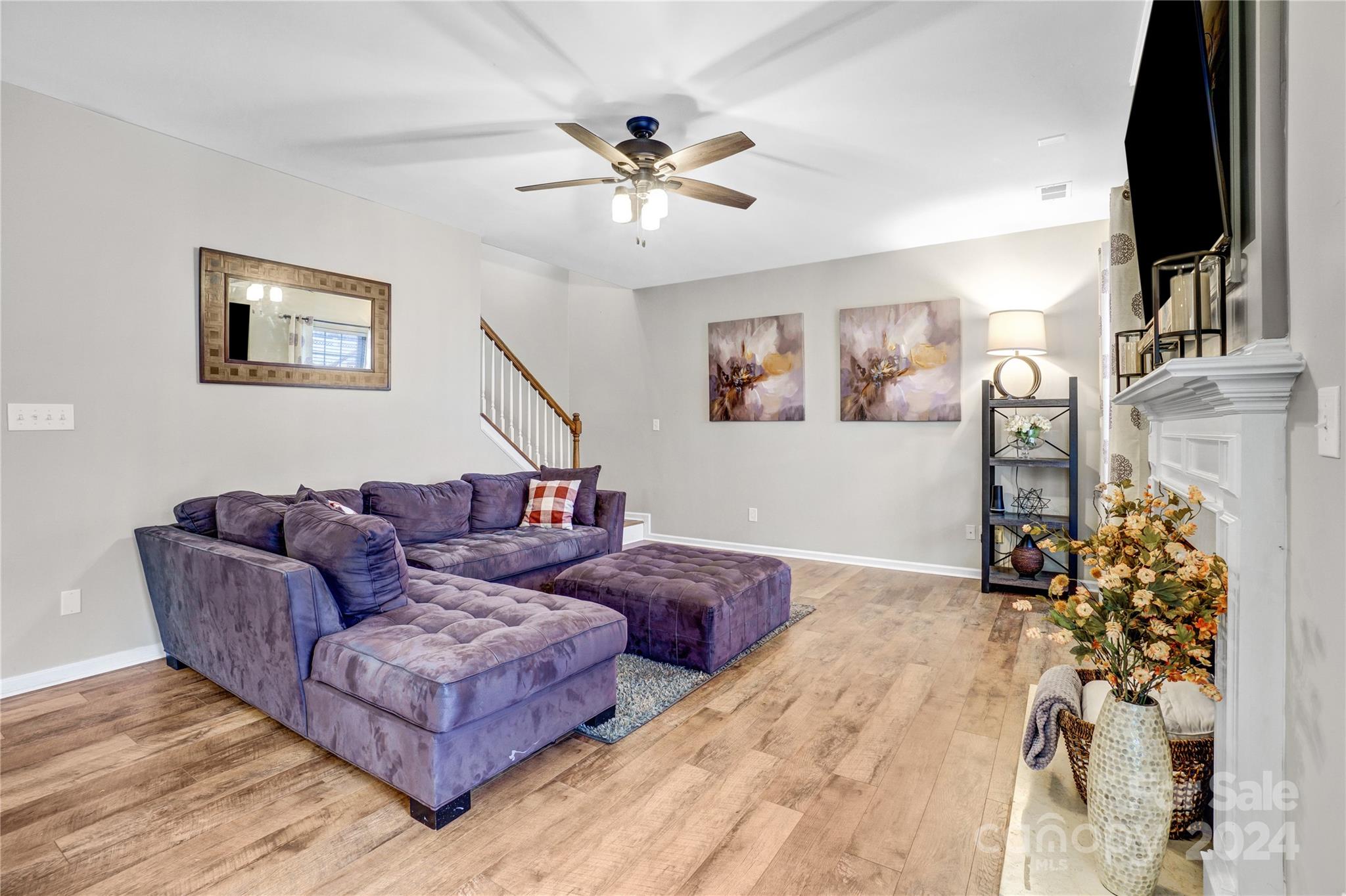 14432 Whistling Swan Road Charlotte, NC 28278 - Photo 12 of 28 a living room with furniture and a flat screen tv
