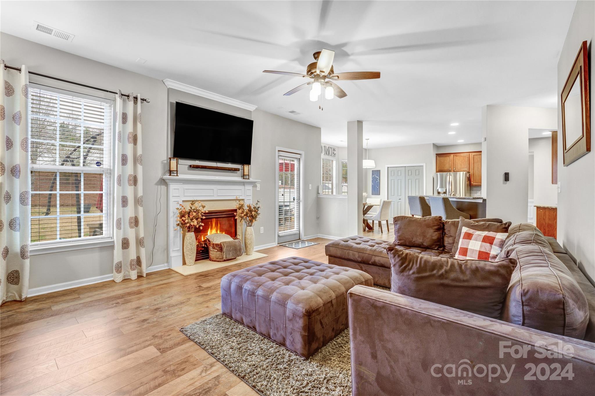 14432 Whistling Swan Road Charlotte, NC 28278 - Photo 13 of 28 a living room with fireplace furniture and a flat screen tv