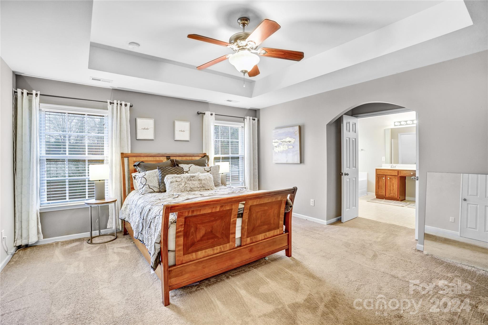 14432 Whistling Swan Road Charlotte, NC 28278 - Photo 14 of 28 a bed room with a bed and a large window