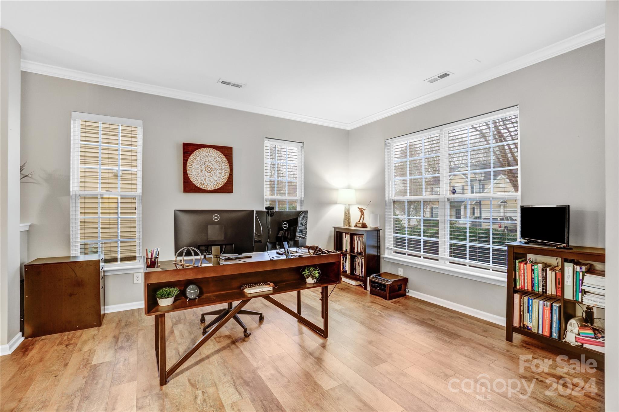 14432 Whistling Swan Road Charlotte, NC 28278 - Photo 6 of 28 a work room with furniture and a flat screen tv