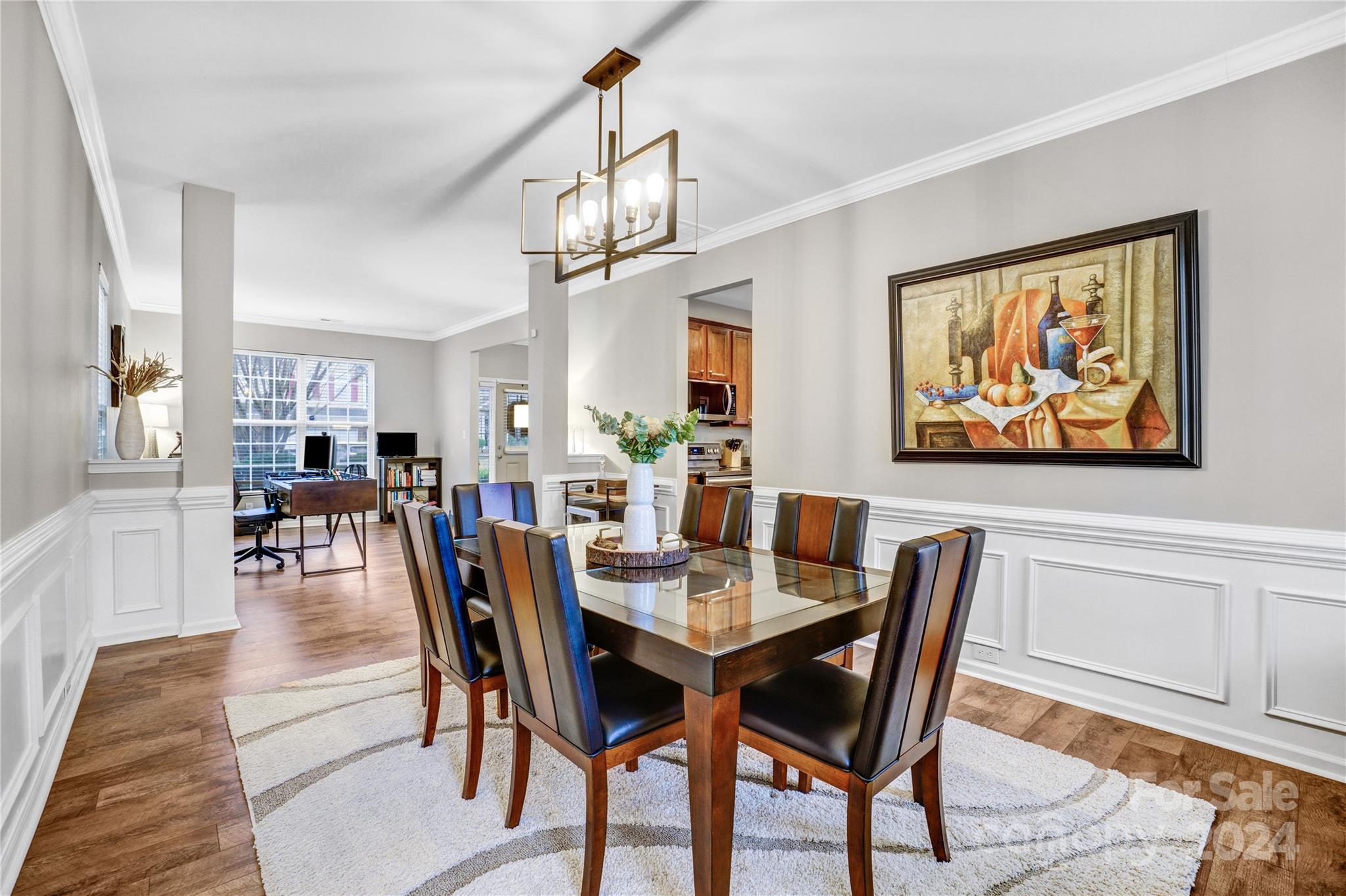 14432 Whistling Swan Road Charlotte, NC 28278 - Photo 10 of 28 a view of a dining room with furniture wooden floor and chandelier