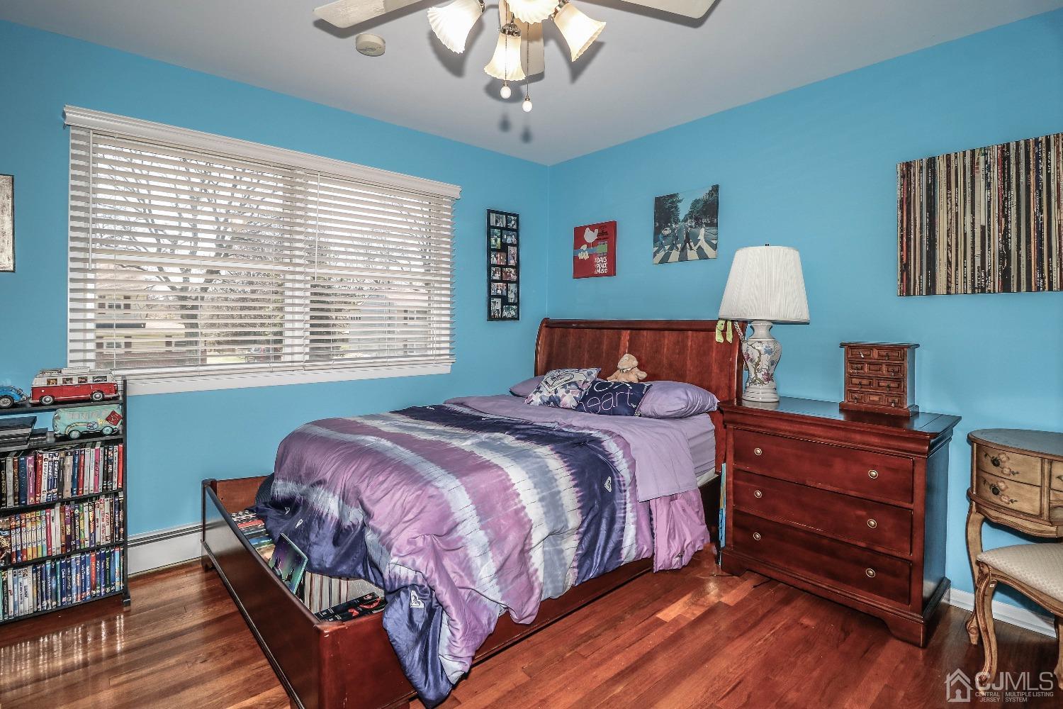 5 Pendleton Place Edison, NJ 08820 - Photo 27 of 37 a bedroom with bed and a chandelier