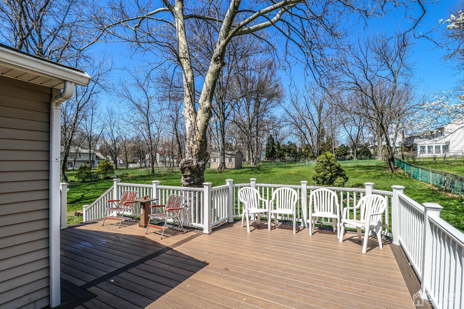 5 Pendleton Place Edison, NJ 08820 - Photo 29 of 37 a view of a deck with chairs and wooden fence