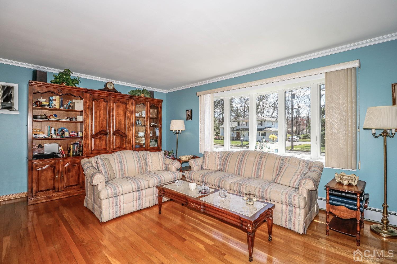 5 Pendleton Place Edison, NJ 08820 - Photo 8 of 37 a living room with furniture and a large window