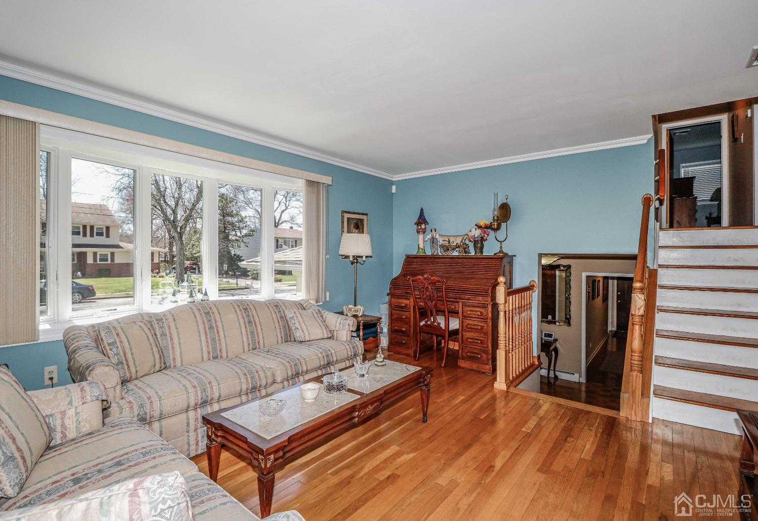5 Pendleton Place Edison, NJ 08820 - Photo 10 of 37 a living room with furniture and a large window