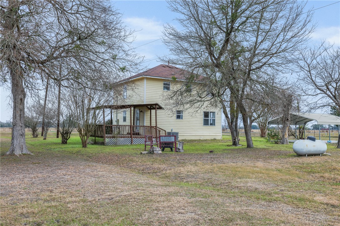 1172 County Road 268 Somerville, TX 77879 - Photo 12 of 40 a view of house with a backyard and trees
