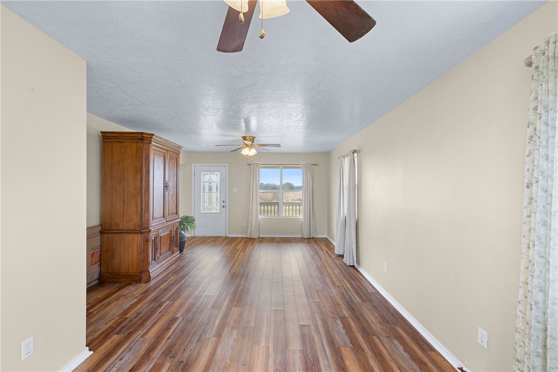 1172 County Road 268 Somerville, TX 77879 - Photo 21 of 40 wooden floor in an empty room with a window