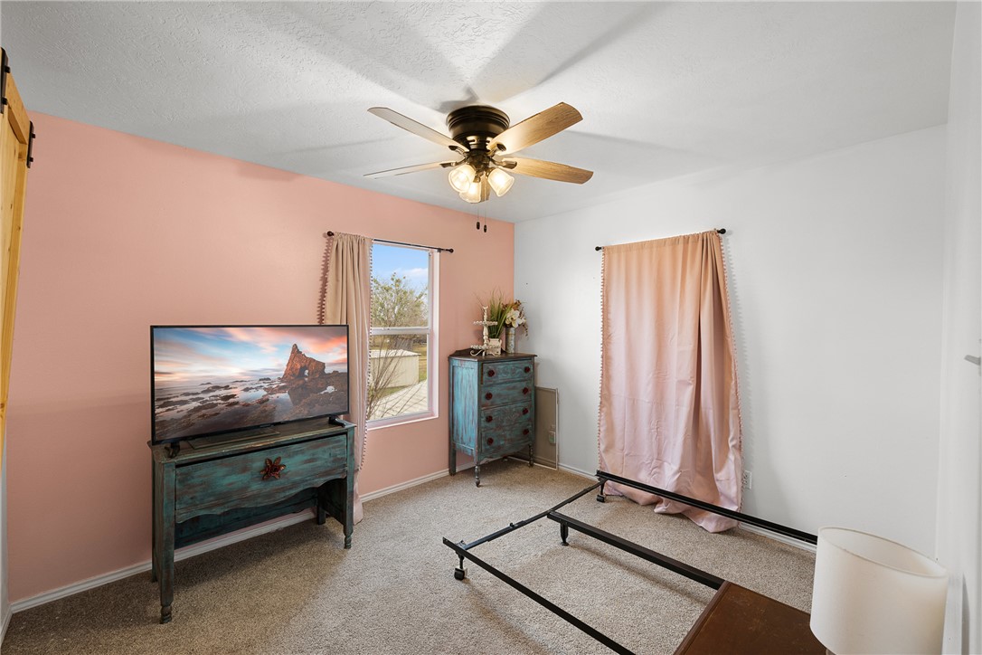 1172 County Road 268 Somerville, TX 77879 - Photo 25 of 40 a living room with furniture and a flat screen tv