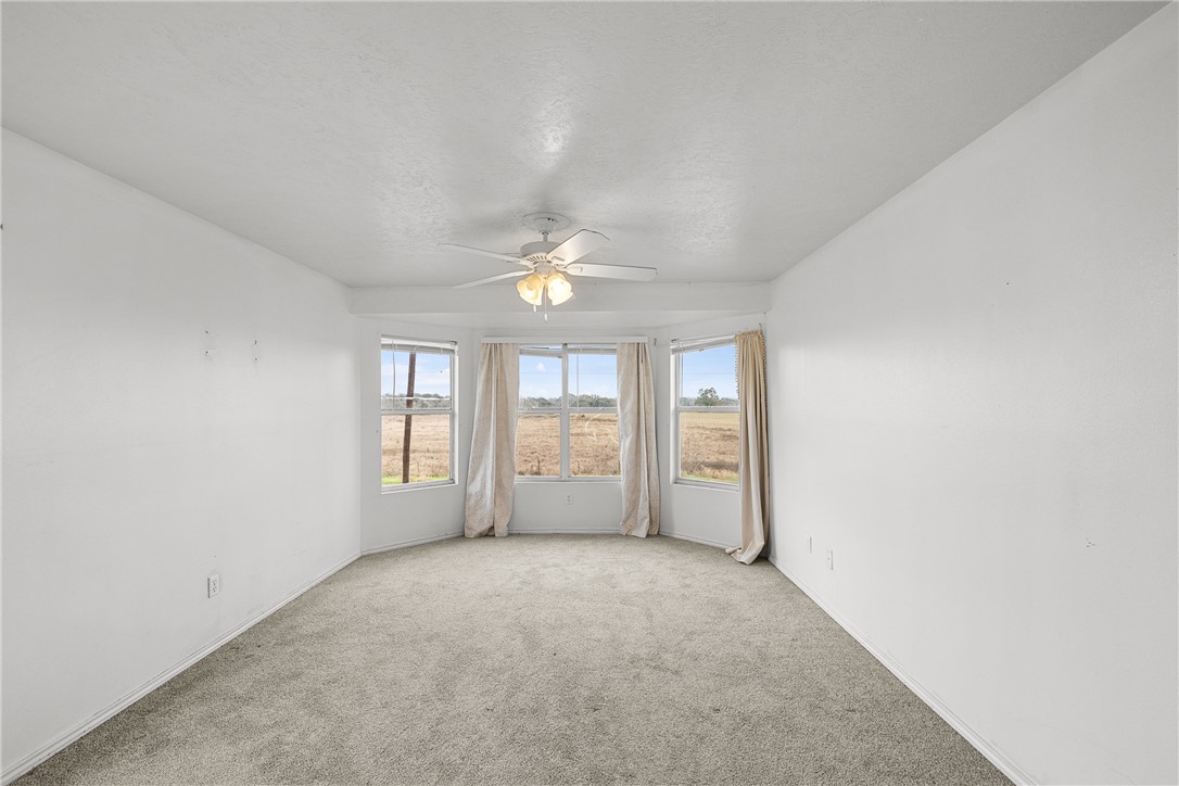 1172 County Road 268 Somerville, TX 77879 - Photo 27 of 40 wooden floor in an empty room with a window