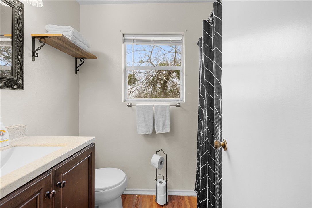 1172 County Road 268 Somerville, TX 77879 - Photo 29 of 40 a bathroom with a toilet sink and mirror