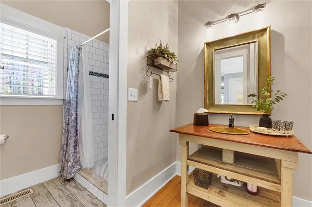 a kitchen with stainless steel appliances granite countertop a stove and a large window