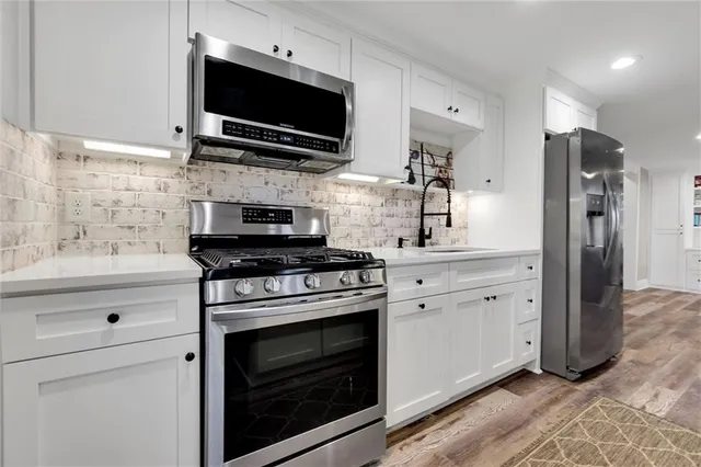 a view of a dinning table and chairs on the roof deck