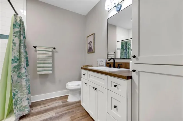 a view of a house with a yard patio and a garden