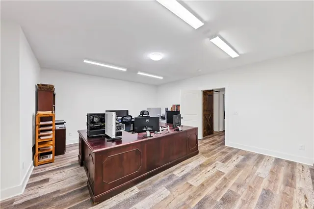a view of a house with a yard and sitting area