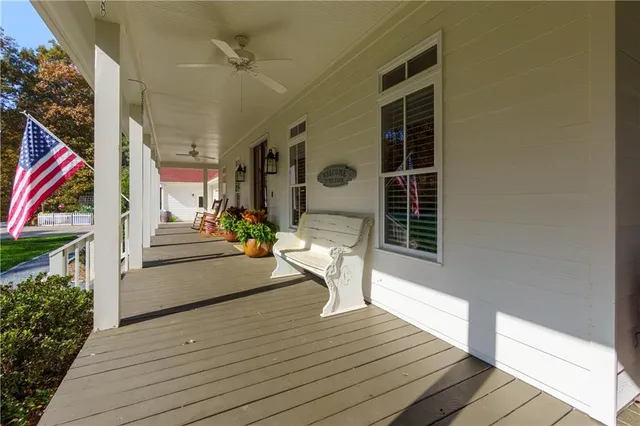 a view of a street with wooden fence