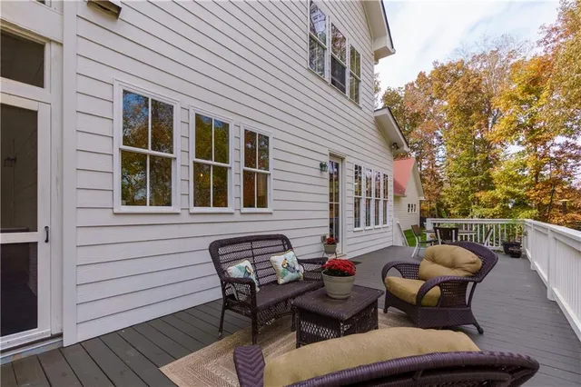 a view of a house with a small yard and wooden fence