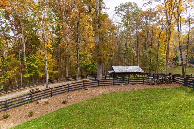 an aerial view of residential houses with outdoor space and street view