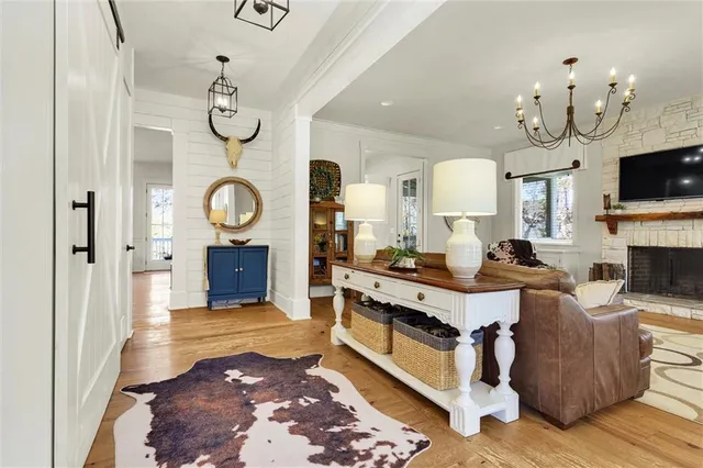 a kitchen with stainless steel appliances white cabinets and a window