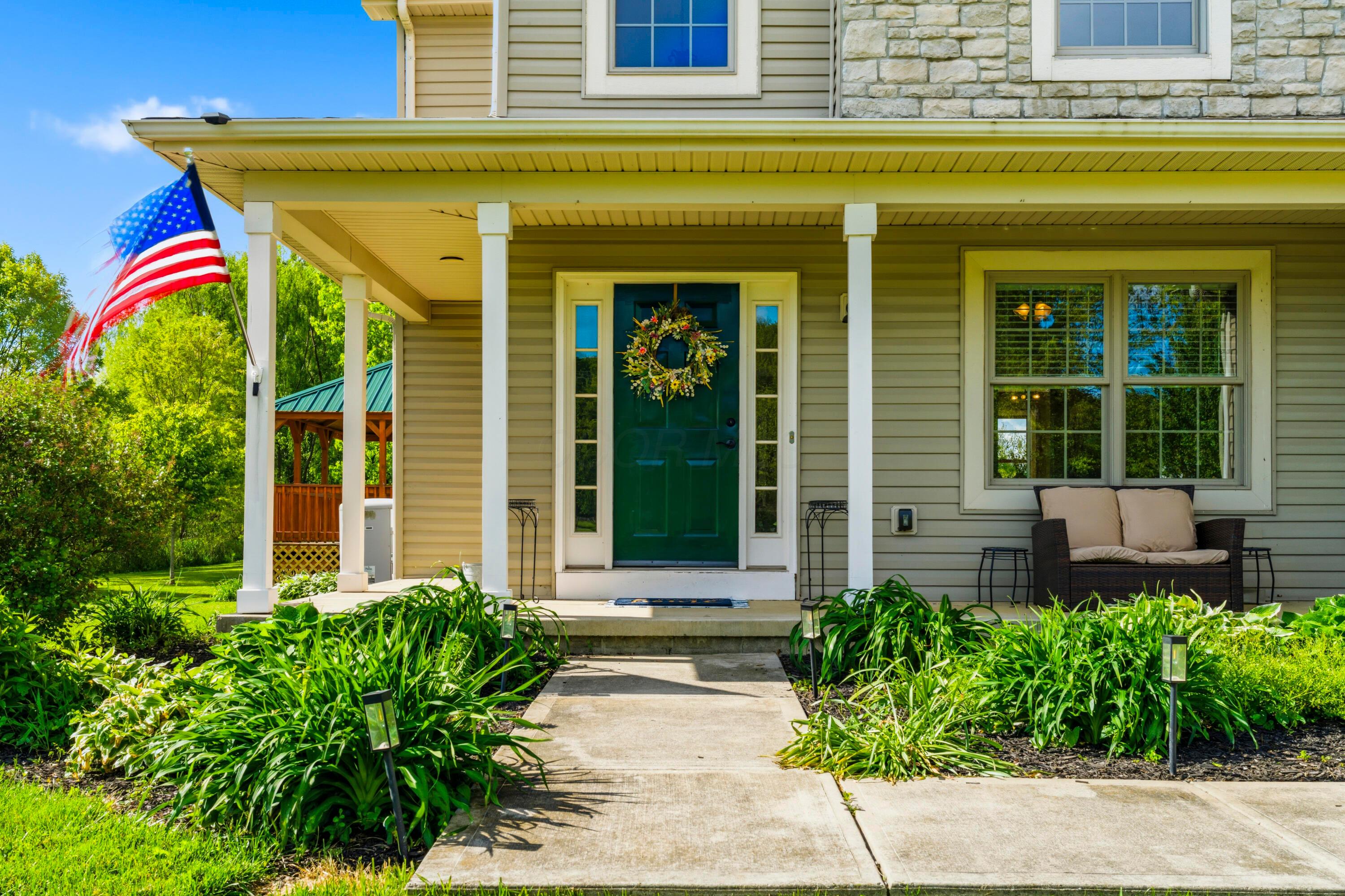 8507 Benner Road Johnstown, OH 43031 - Photo 2 of 69 Unwind on the front porch, overlooking your yard! Perfect place to start or end the day!