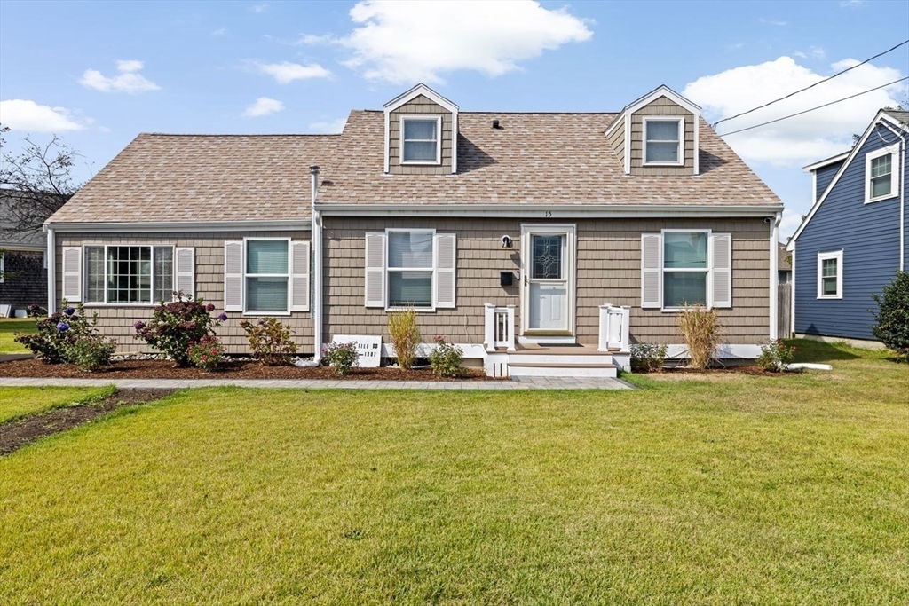 15 Packard Avenue Hull, MA 02045 - Photo 1 of 32 a front view of a house with swimming pool having outdoor seating