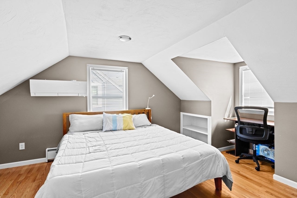 15 Packard Avenue Hull, MA 02045 - Photo 26 of 32 a bedroom with a bed and wooden floor
