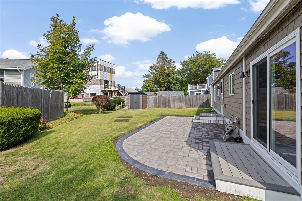 15 Packard Avenue Hull, MA 02045 - Photo 4 of 32 a view of a backyard with a garden