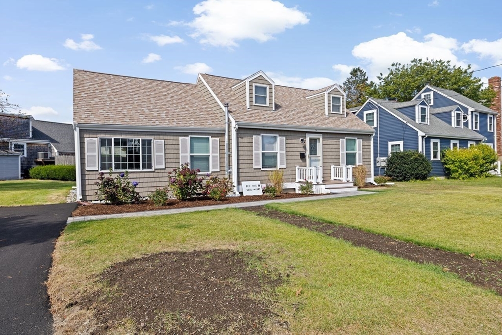 15 Packard Avenue Hull, MA 02045 - Photo 9 of 32 a front view of a house with swimming pool having outdoor seating
