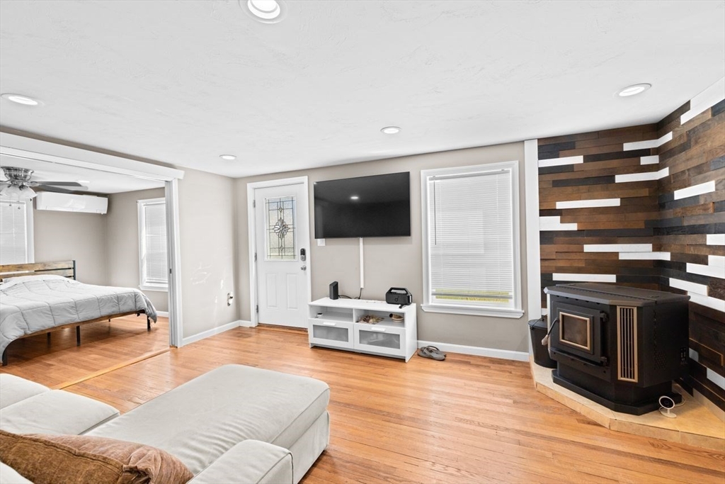 15 Packard Avenue Hull, MA 02045 - Photo 10 of 32 a living room with furniture and a flat screen tv