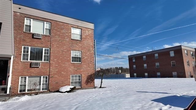 99 Cluff Crossing Road, Unit C12 Salem, NH 03079 - Photo 2 of 6 a house view with a outdoor space
