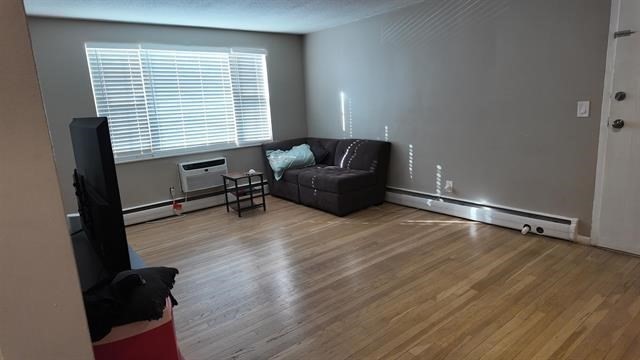 99 Cluff Crossing Road, Unit C12 Salem, NH 03079 - Photo 4 of 6 a living room with furniture and a window