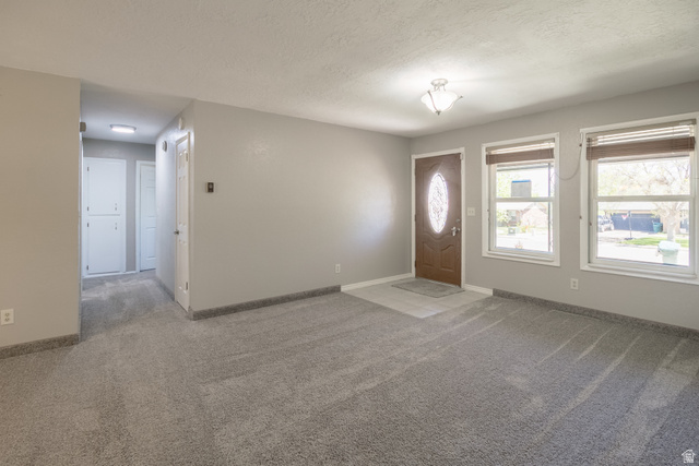 634 South 2100th Street West Vernal, UT 84078 - Photo 3 of 71 Grey carpeting throughout the main room and hallway