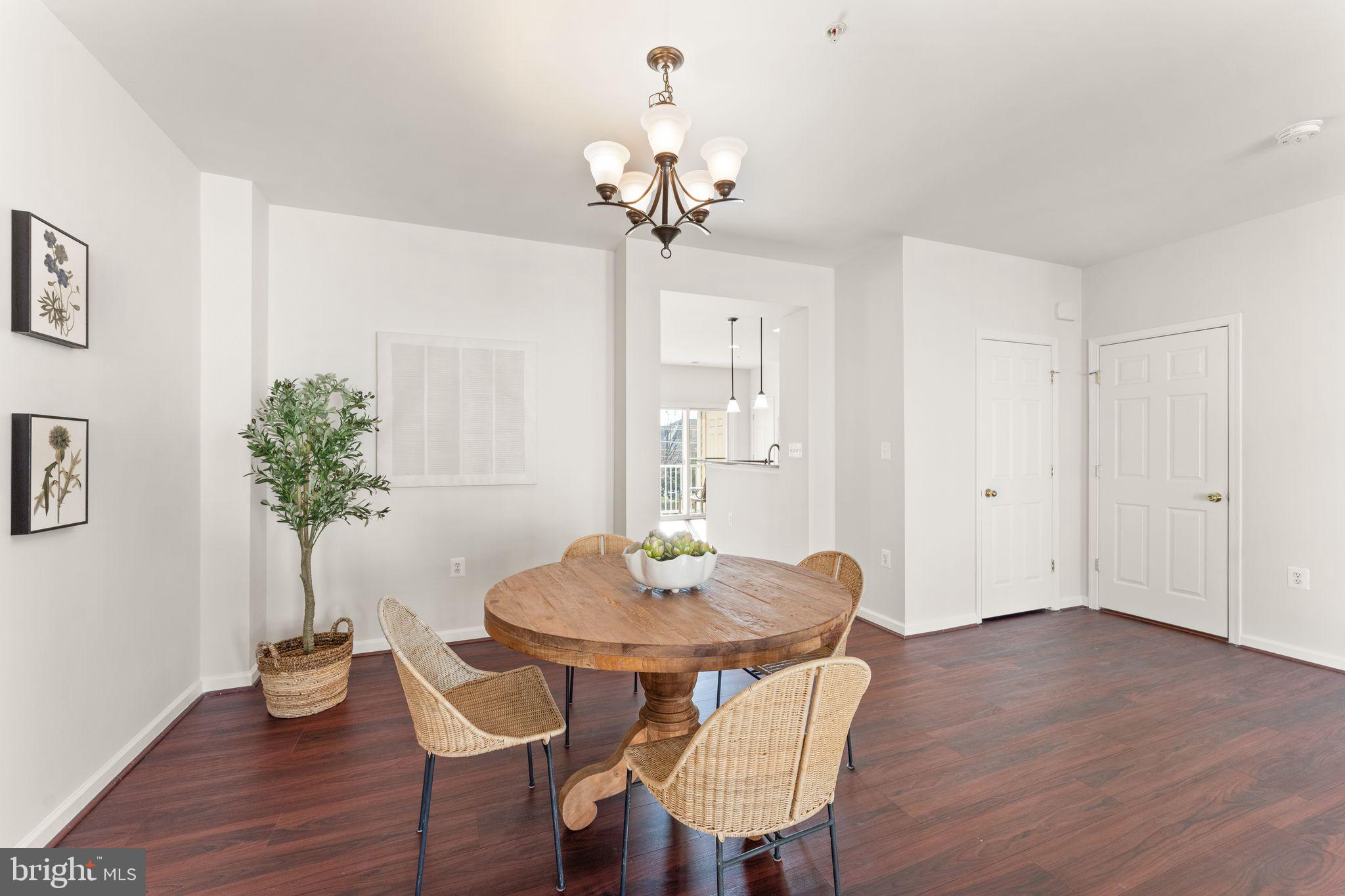 6072 Wicker Lane, Unit 160 Centreville, VA 20121 - Photo 11 of 58 a view of a dining room with furniture and wooden floor