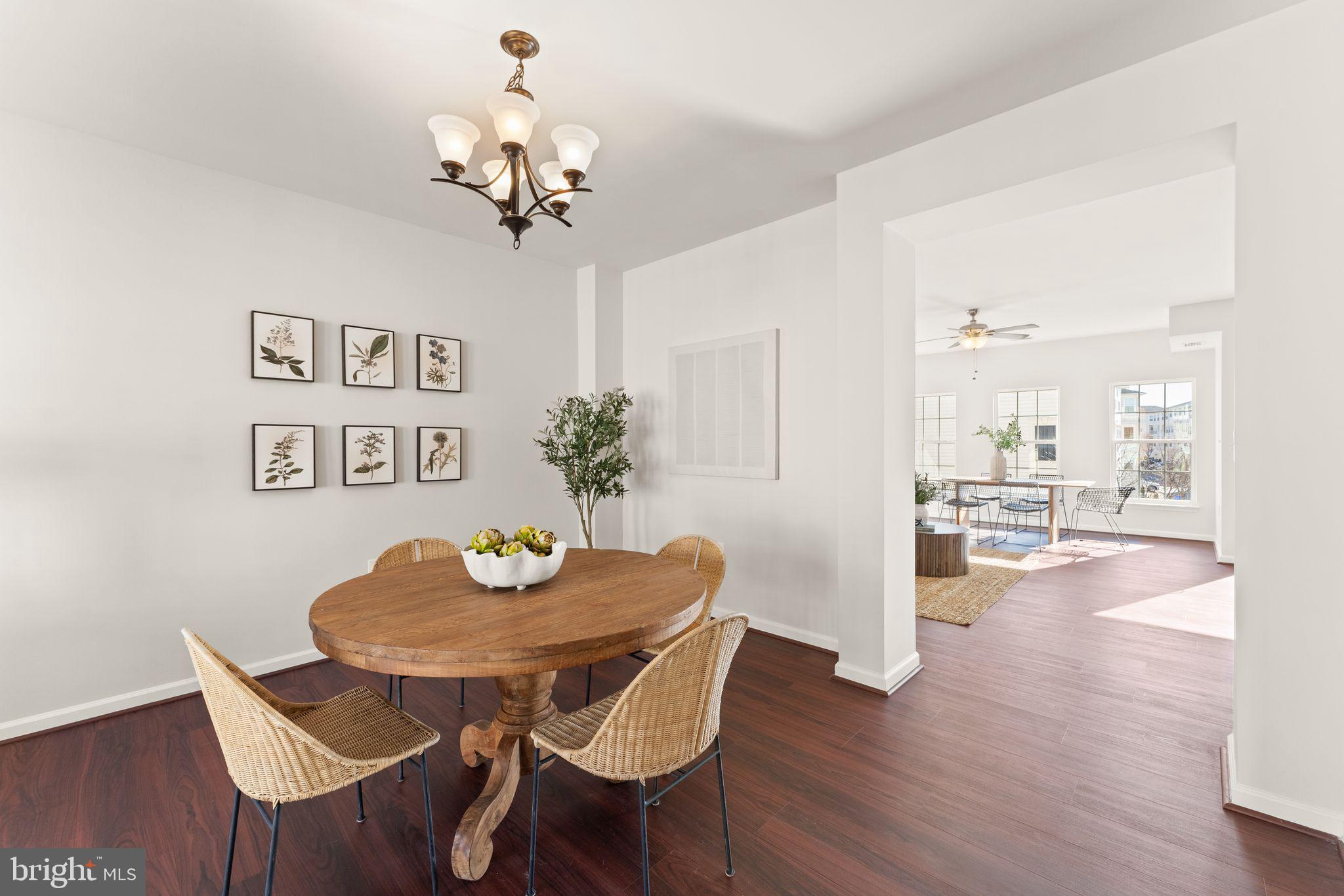 6072 Wicker Lane, Unit 160 Centreville, VA 20121 - Photo 12 of 58 a view of a dining room with furniture wooden floor and chandelier