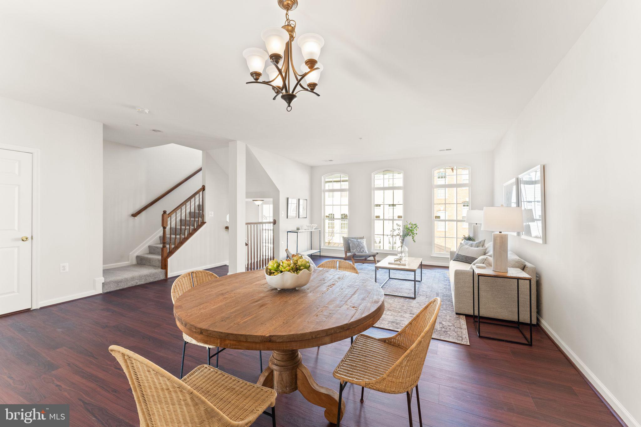 6072 Wicker Lane, Unit 160 Centreville, VA 20121 - Photo 13 of 58 a view of a dining room with furniture and wooden floor