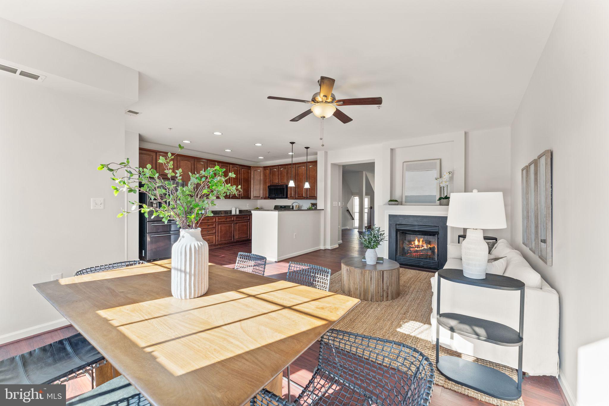 6072 Wicker Lane, Unit 160 Centreville, VA 20121 - Photo 20 of 58 a living room with furniture a fireplace and a chandelier