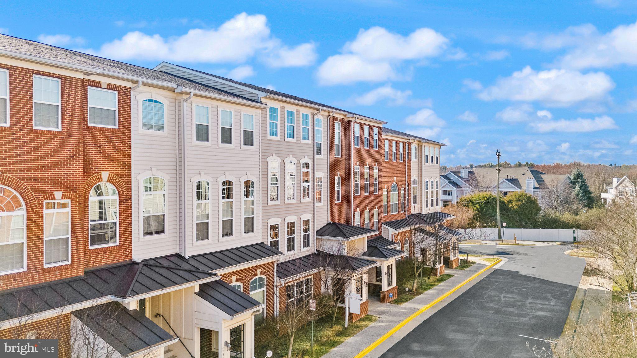 6072 Wicker Lane, Unit 160 Centreville, VA 20121 - Photo 2 of 58 a view of a building with many windows