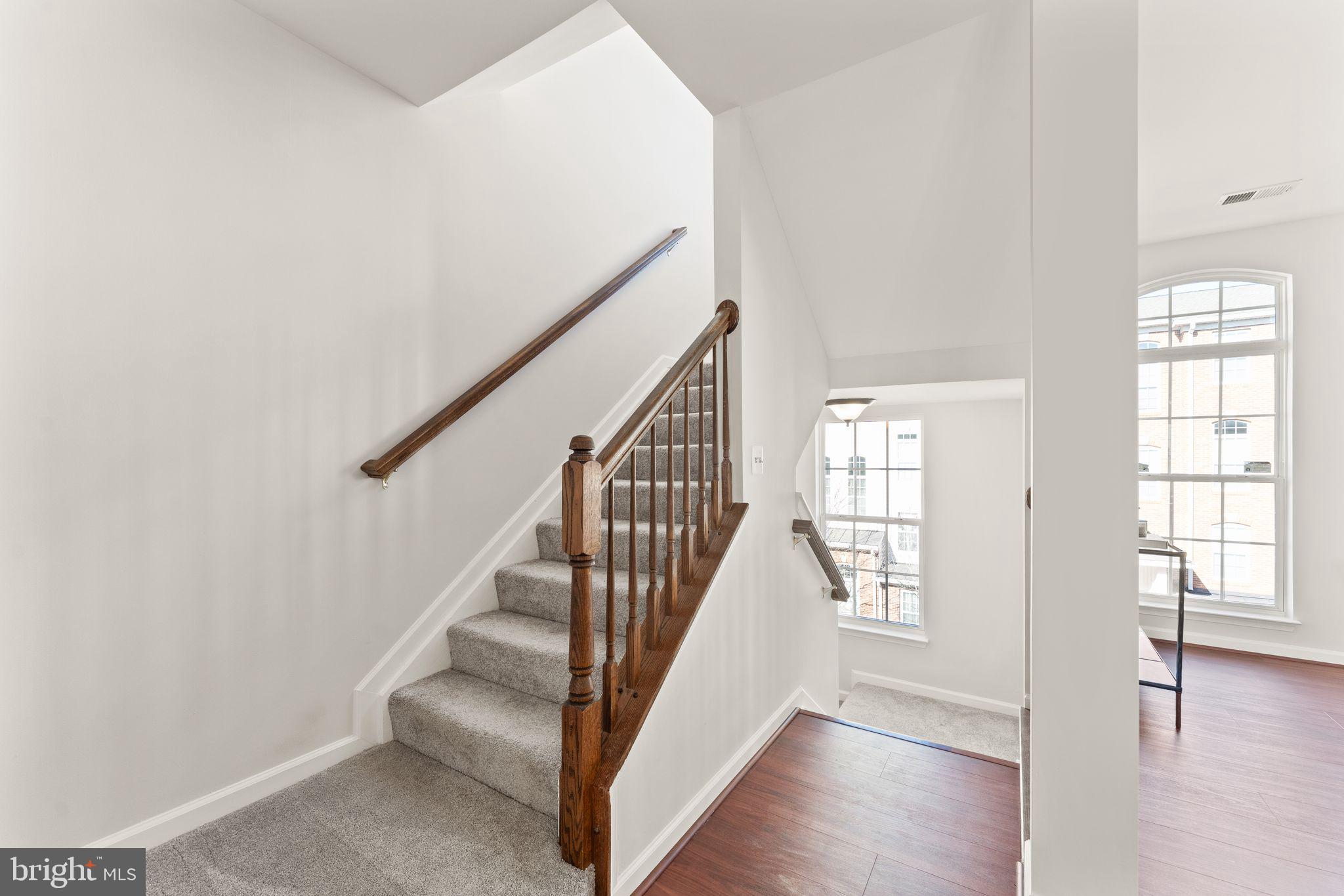 6072 Wicker Lane, Unit 160 Centreville, VA 20121 - Photo 30 of 58 a view of entryway and hall with wooden floor