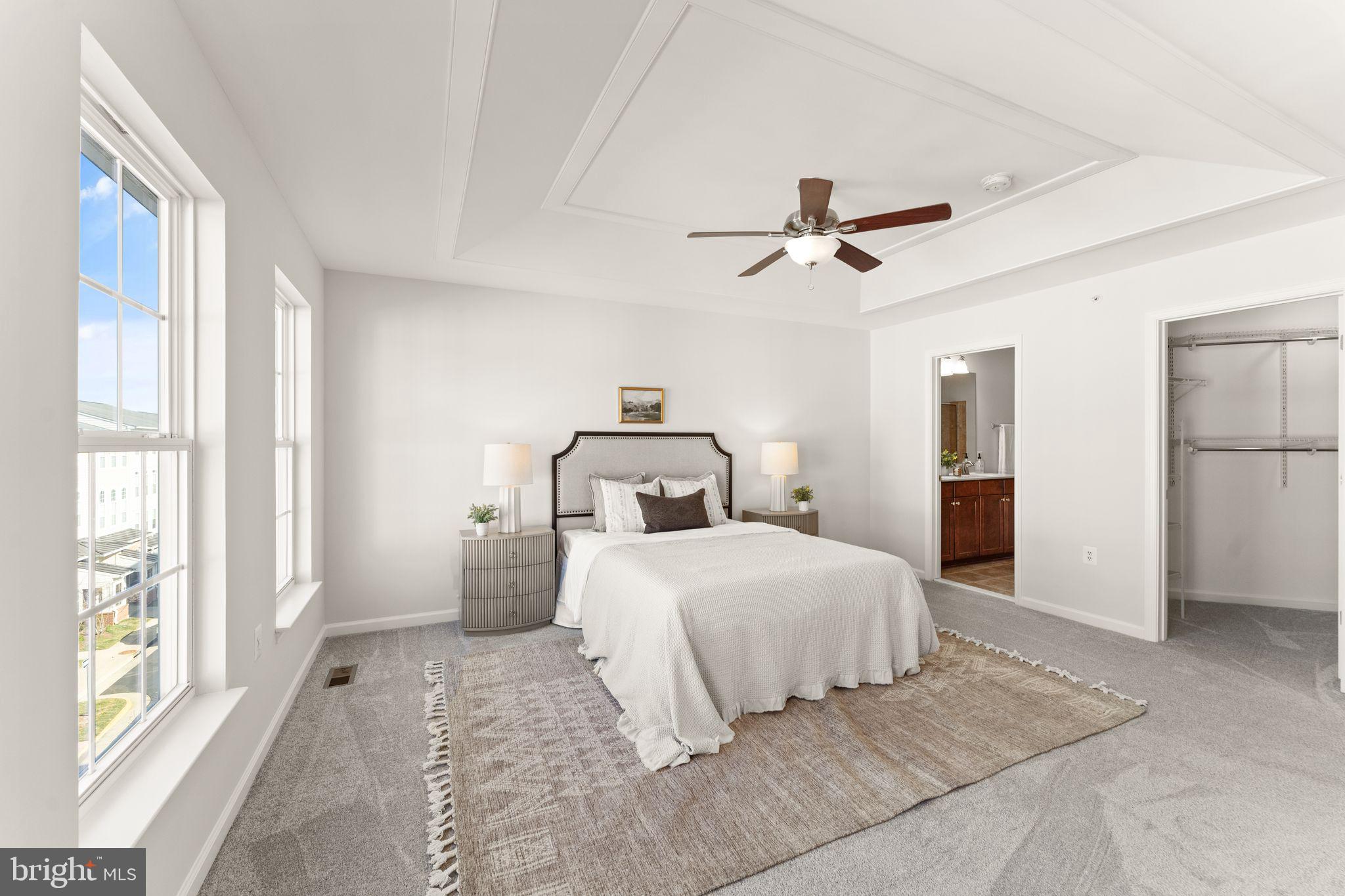 6072 Wicker Lane, Unit 160 Centreville, VA 20121 - Photo 33 of 58 a bedroom with a large bed and a chandelier