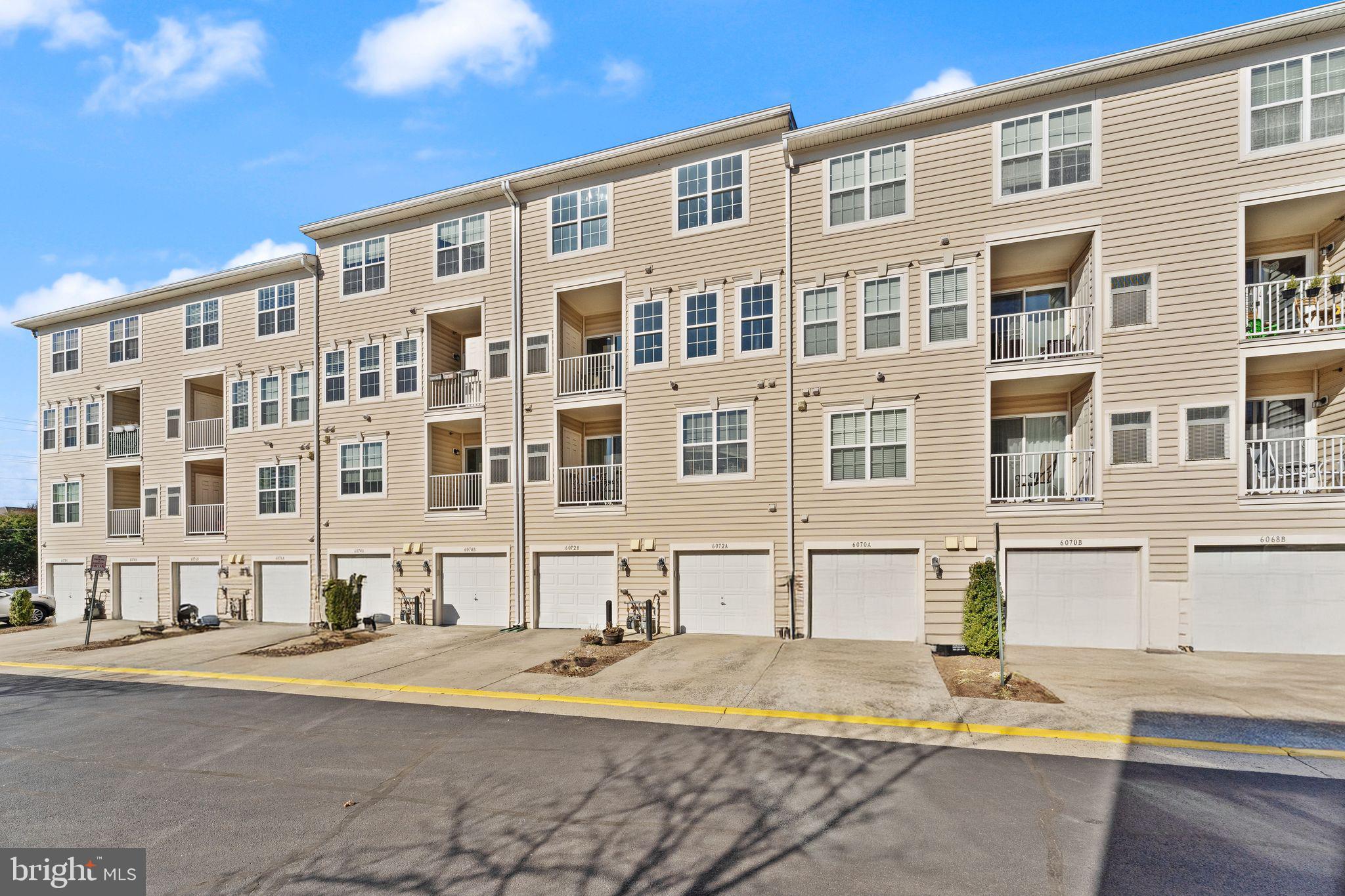 6072 Wicker Lane, Unit 160 Centreville, VA 20121 - Photo 49 of 58 a front view of a building with street view